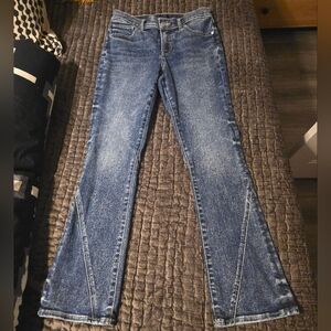 Mid Rise Medium Wash Twist Seam Skyscraper Jeans